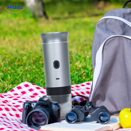 Portable espresso machine with capsules and additional accessories displayed.