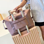 Expandable travel bag in gray with versatile design for everyday trips.