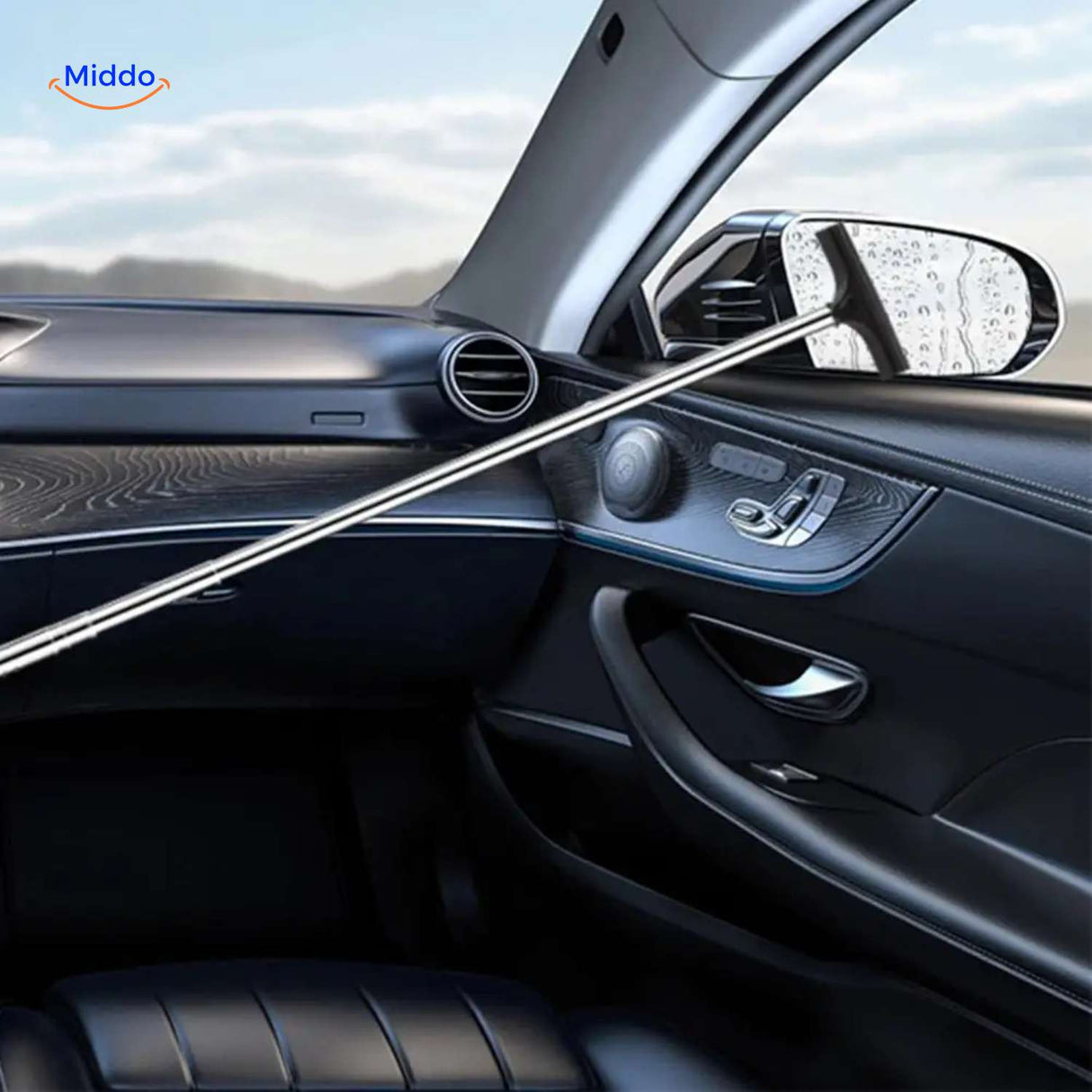 Extra-long telescopic squeegee reaching exterior car windows without streaks.