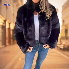Women's black faux fur coat with high collar and luxe warmth styling.