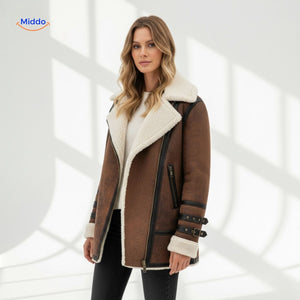 Women's long faux fur coat worn indoors in natural light, styled for a chic autumn look.