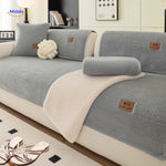 Faux lambswool sofa cover displayed with blue-gray textured blankets for modern living.