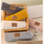 Textured faux lambswool cover styled with multi-colored bolster pillows and throws.