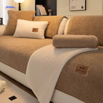 Cozy faux lambswool sofa cover paired with cheerfully colored wool blankets.