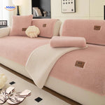 Soft faux lambswool cover styled with warm rose-colored luxury blankets.