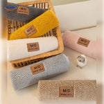 Luxe faux lambswool sofa cover showcasing soft warmth with layered throw blankets.