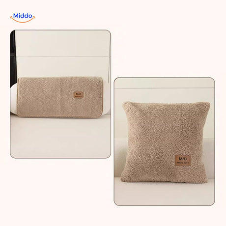 Beige faux lambswool sofa cover styled with matching pillows and throw blankets.