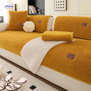 Luxe faux lambswool fabric enhanced with soft yellow-toned throw blankets.