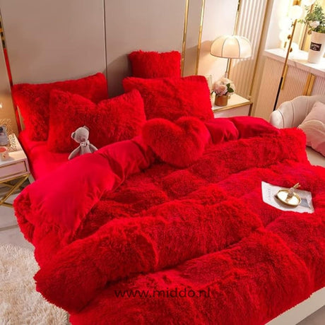 Red teddy fleece bedding set with soft plush material and complementary heart pillow