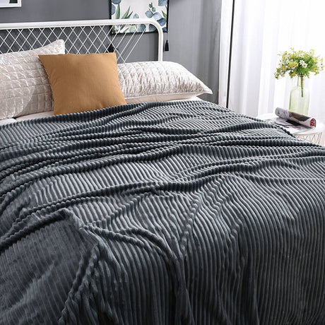Sleek dark gray velvet fleece blanket matches modern interiors.
