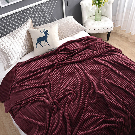 Deep burgundy velvet fleece blanket adds warmth to any space.
