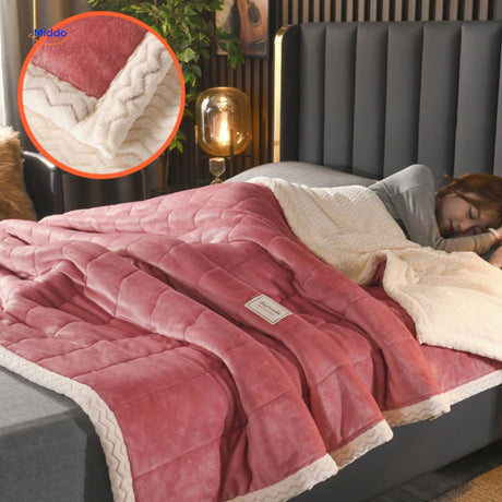 Dark rose and white blocked wool blanket on contemporary bedding.