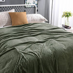 Vibrant green velvet fleece blanket brings nature-inspired comfort.