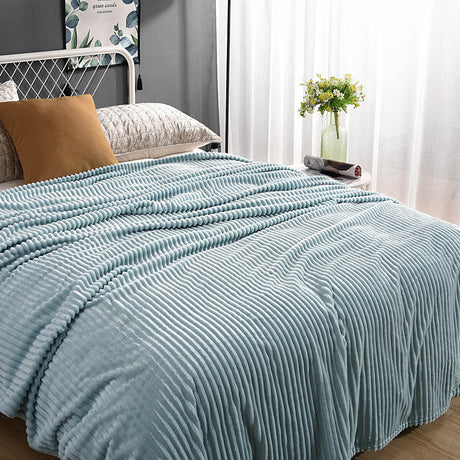 Soft light blue velvet fleece blanket creates a calming atmosphere.