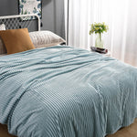 Soft light blue velvet fleece blanket creates a calming atmosphere.