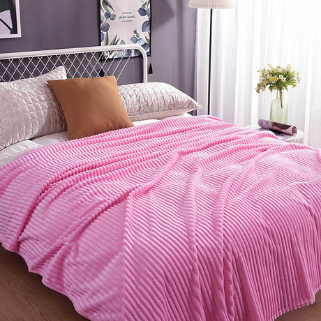 Pretty pink velvet fleece blanket perfect for a cozy bedroom.