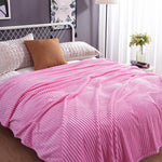 Pretty pink velvet fleece blanket perfect for a cozy bedroom.