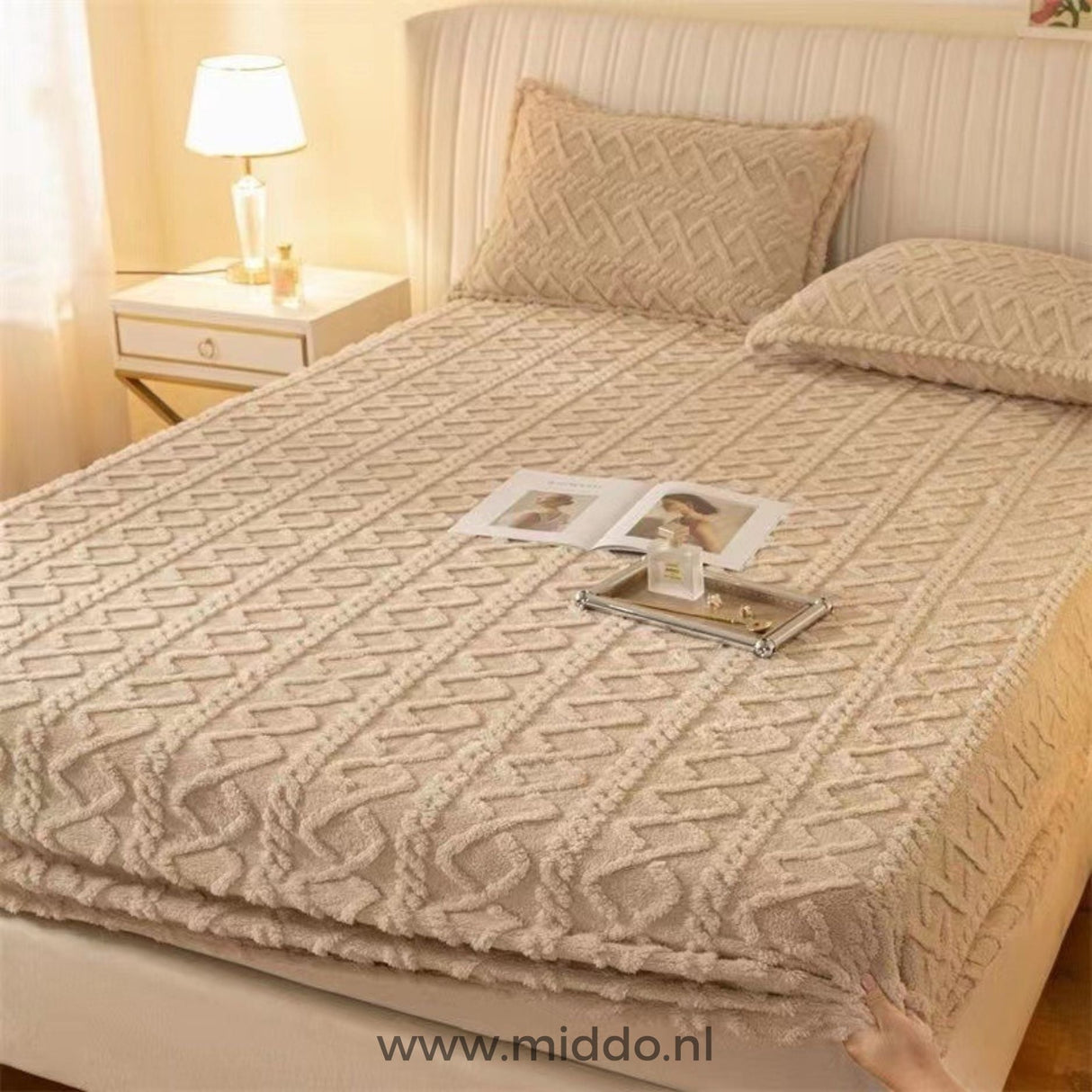 Fleece fitted sheet in soft beige neutral color option.