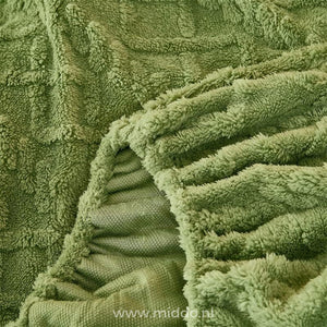 Fleece fitted sheet demonstrating secure fitted corners.
