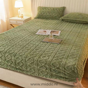 Fleece fitted sheet in calming moss green color.