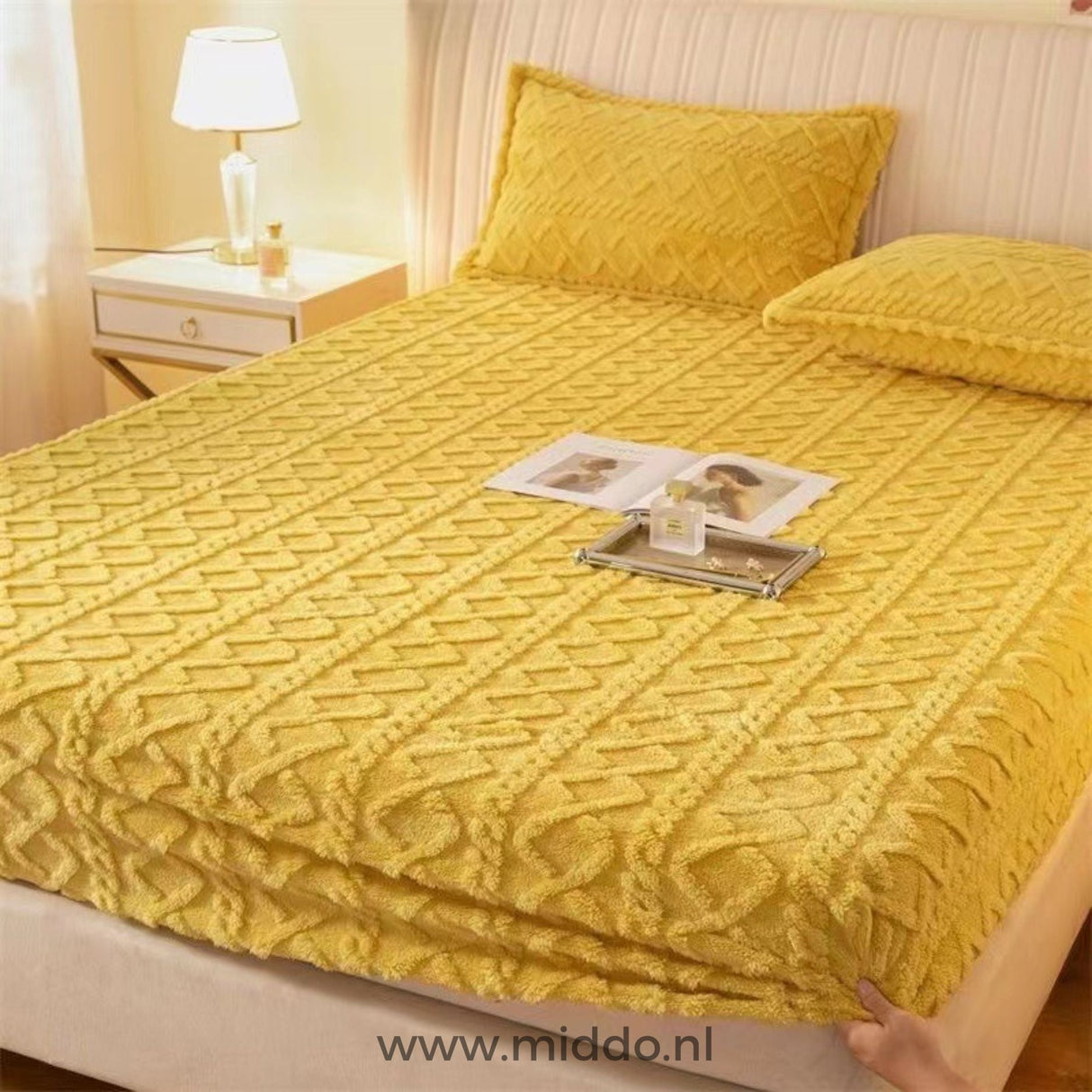 Fleece fitted sheet in cheerful yellow color variant.