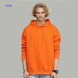 Orange fleece hoodie worn by model in casual lifestyle pose