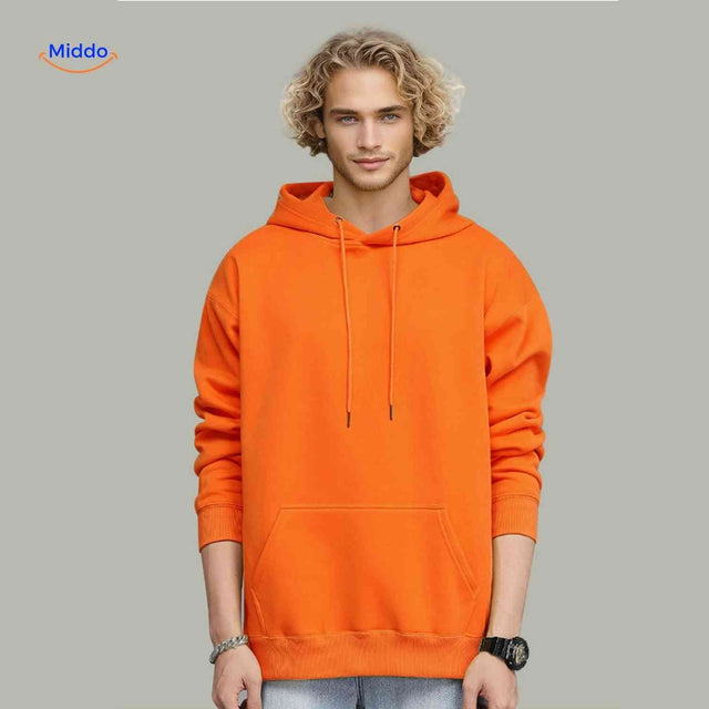 Orange fleece hoodie worn by model in casual lifestyle pose