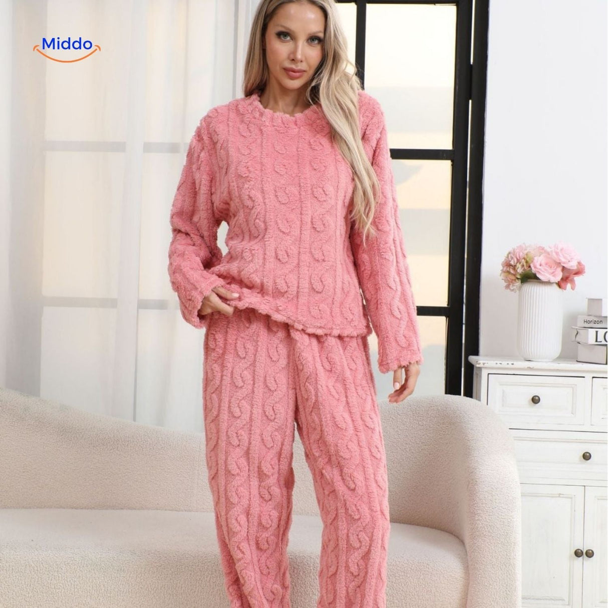 Pink fleece pajama set offering soft comfort and warmth for bedtime.