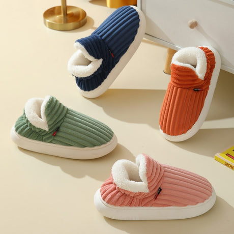 Complete color range of therapeutic slippers available in blue, orange, green, and pink.