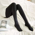 Double-weight black fleece tights with half-foot cut for flexibility.