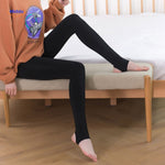 Folded thermal fleece-lined pantyhose in beige and black for compact storage.