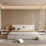 Flexible PVC wood-look wall panel roll demonstrating the material's bendable quality.