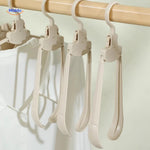 FlexiHanger Pro durable adjustable hanger for versatile home and travel use.