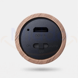 Bottom view of motion-activated LED lamp showing sensor and charging port.