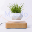 FloatPot levitating plant pot in light brown ceramic finish.