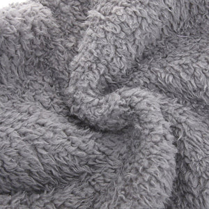 Detailed close-up of FluffSoks soft plush interior fabric composition.