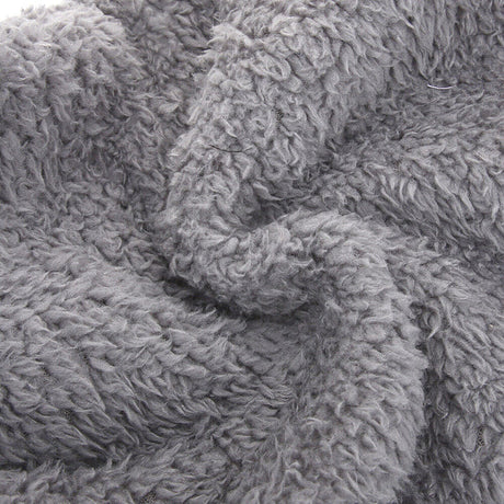Detailed close-up of FluffSoks soft plush interior fabric composition.