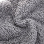 Detailed close-up of FluffSoks soft plush interior fabric composition.