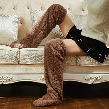 Brown FluffSoks knee-high cozy socks displayed on a comfortable couch setting.