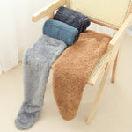 FluffSoks cozy socks available in multiple warm color options.