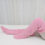 Pink FluffSoks warm socks keeping feet cozy and comfortable.