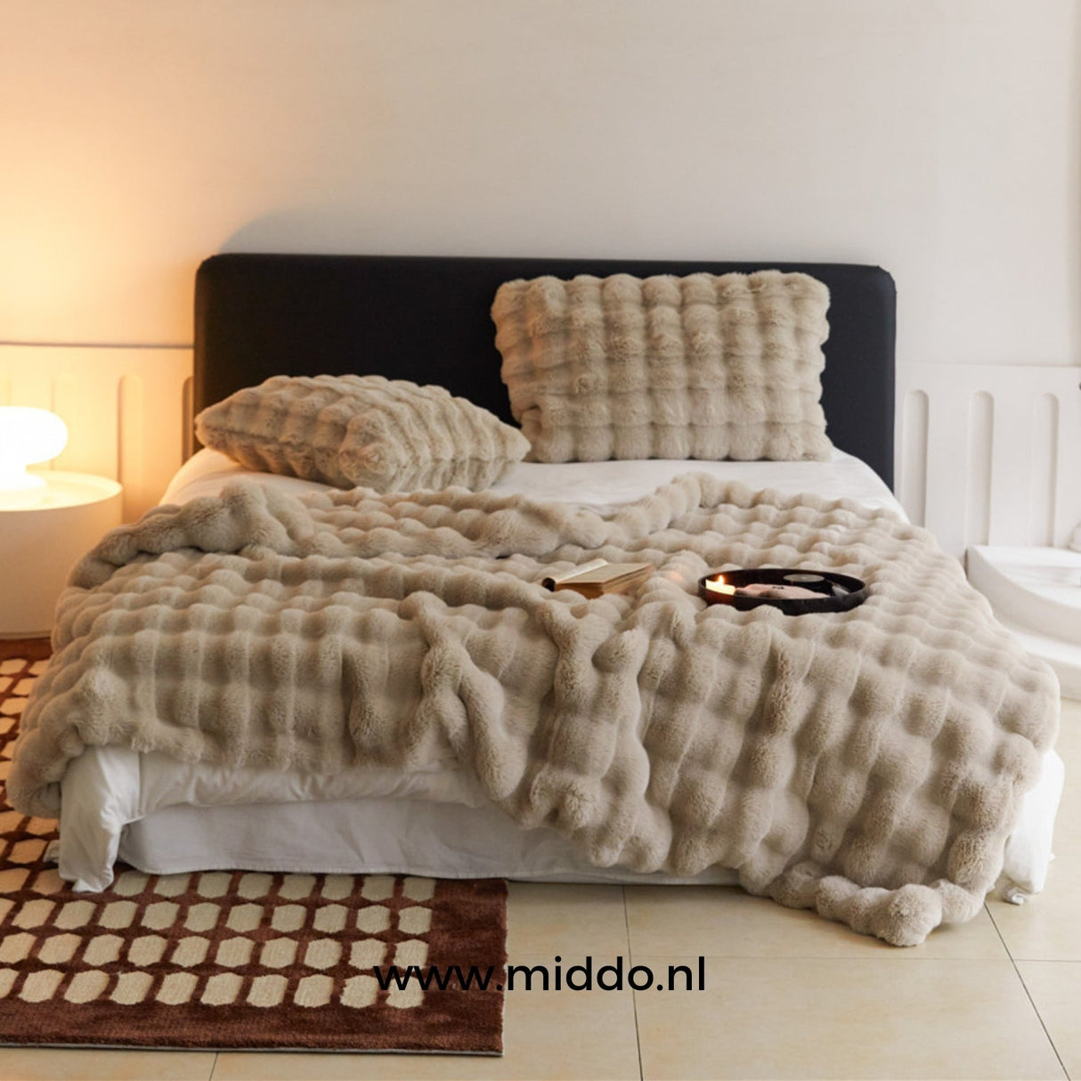 Fluffy winter blanket in beige faux fur, neutral tone for any room.