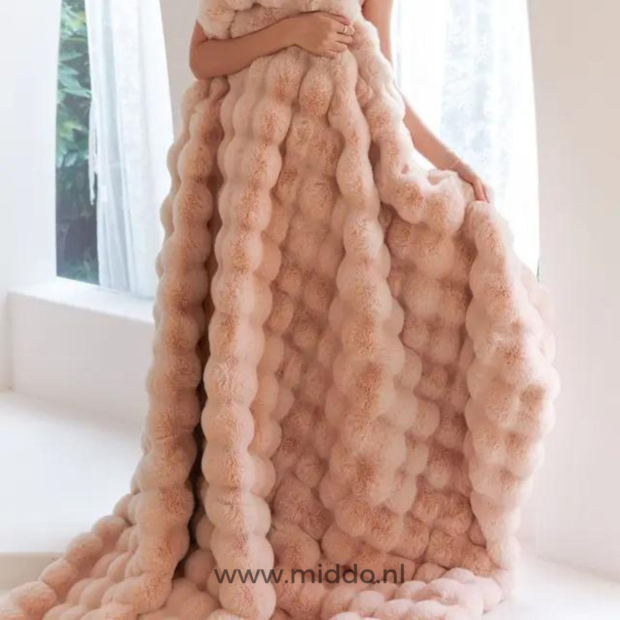 Fluffy winter blanket draped to show the thick, luxurious faux fur.