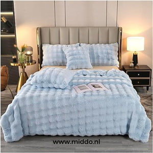 Fluffy winter blanket in light blue faux fur, extra thick and cozy.