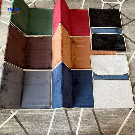 Foldable travel prayer mats laid flat showing all available colors side by side.