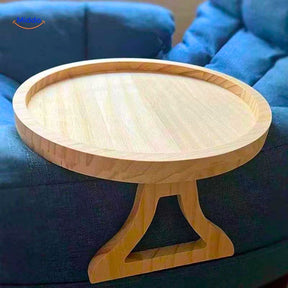 ComfyGrip sofa table installed on blue upholstered armrest with bamboo tray surface.