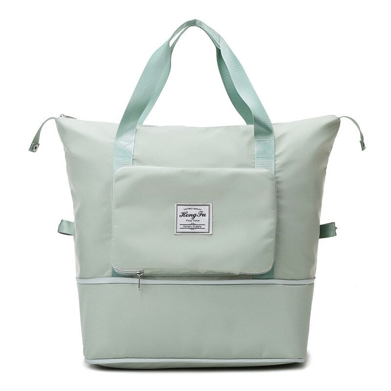 Sage green waterproof expandable travel bag with large capacity and folding design.