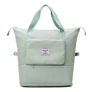Sage green waterproof expandable travel bag with large capacity and folding design.