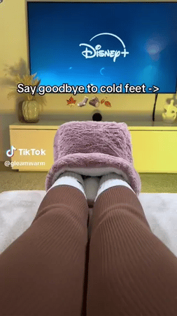 Cozy foot warmer perfect for warming cold feet while watching TV.