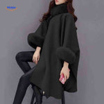 Furina black wool cape coat showing luxe faux-fur collar accent and structured neckline.